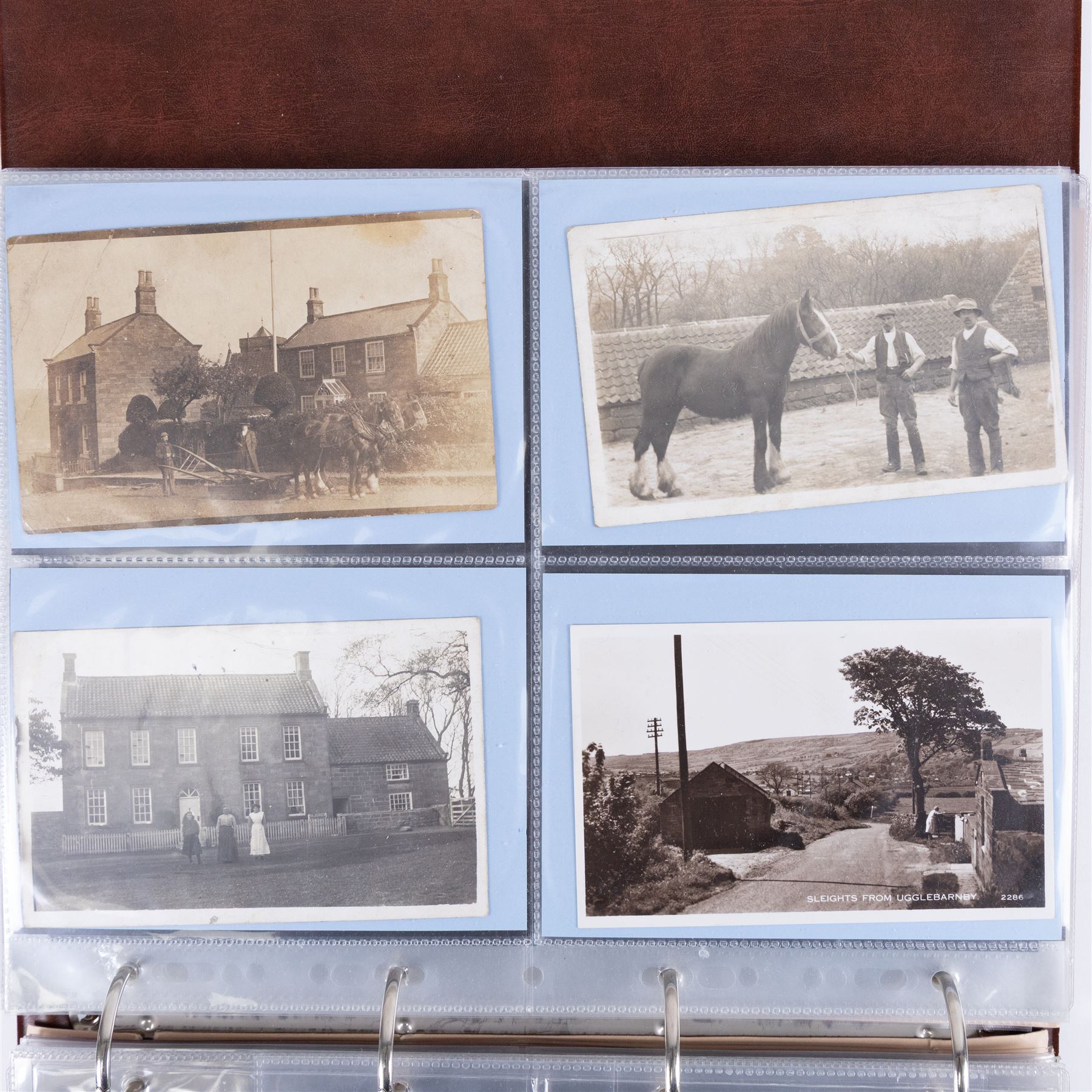 Four-hundred and twelve early 20th century Whitby District view real photographic postcards, including a selection from the Whitby Coast (176), starting at Staithes and Runswick Bay down to Robin Hoods Bay and a selection from the Valley of the River Esk (236), including Ruswarp, Rig Mill, Sneaton, Sleights, Grosmont, Egton, Glaisdale, Danby, Castleton and Goathland, all housed within two postcard albums