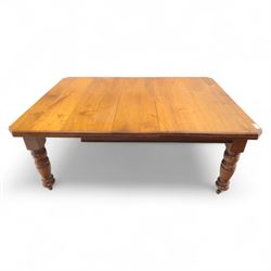 Victorian mahogany extending dining table, rectangular top with chamfered corners above a plain frieze raised on turned reeded legs with castors and two additional leaves, 197cm fully extended, and a set of six early 20th century oak upholstered chairs with drop-in seats, arched panelled back splat and close studded border on turned front legs joined by stretchers, 47x41x109cm 