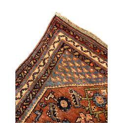 Small Persian rug or mat, decorated with Herati motifs within pattern borders 