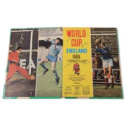 'World Cup 1966 England' hardback book, signed to inner front page by thirteen legendary footballers, to include Bobby Moore, Pele, George Cohen, Bobby Charlton, Alan Ball, Nobby Stiles, Roger Hunt, Peter Thompson, Kenneth Wolstenholme, Jairzinho, Garrincha, Martin Peters and Geoff Hurst, with certificate of authenticity from Chaucer Auctions