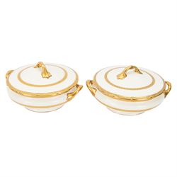 Royal Doulton 'The Balmoral' pattern dinner service for twelve place settings, comprising dinner plates, soup bowls and saucers, side plates, cake plates, three graduating meat platters, pair of tureens with covers and a pair of sauce boats with saucers, all with printed marks beneath