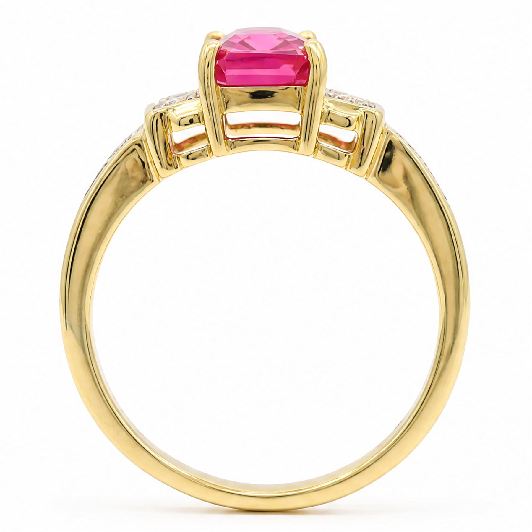 18ct gold pink pink spinel and diamond ring, single emerald cut spinel of approx 1.85 carat, with a round brilliant cut diamond set either side and diamond set shoulders, Birmingham assay mark