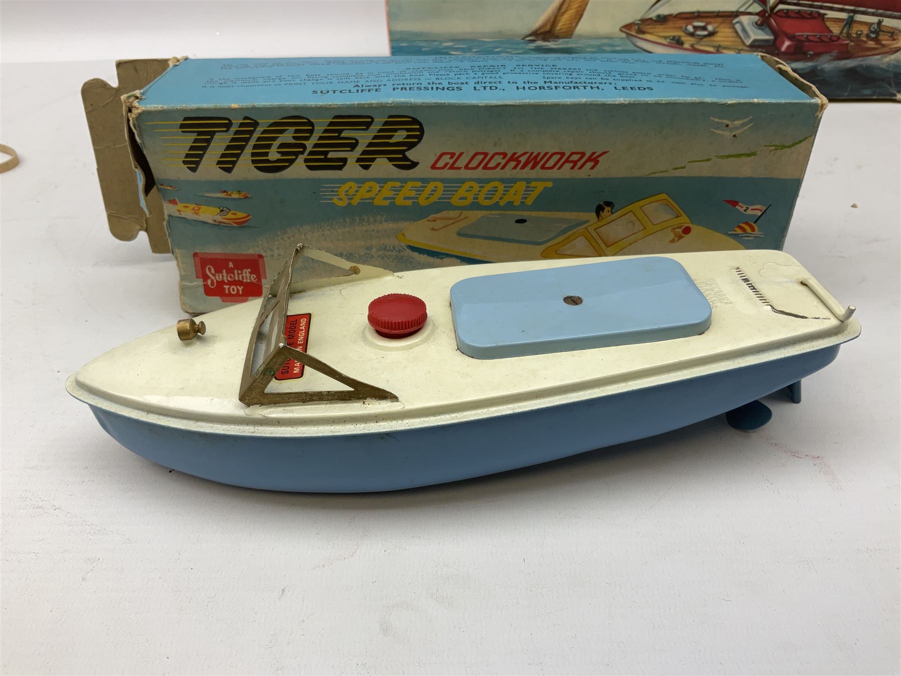 Five model boats - Sutcliffe clockwork Tiger Speedboat; boxed; Motor Sailor battery operated yacht; boxed; Waterline battery operated police launch; boxed; and Tri-ang Scalex 'Aberdeen' North Sea Drifter; boxed, with another similar unboxed (5)