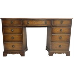 Georgian design mahogany twin pedestal desk, fitted with single frieze drawer flanked by eight graduating cock-beaded drawers, on bracket feet