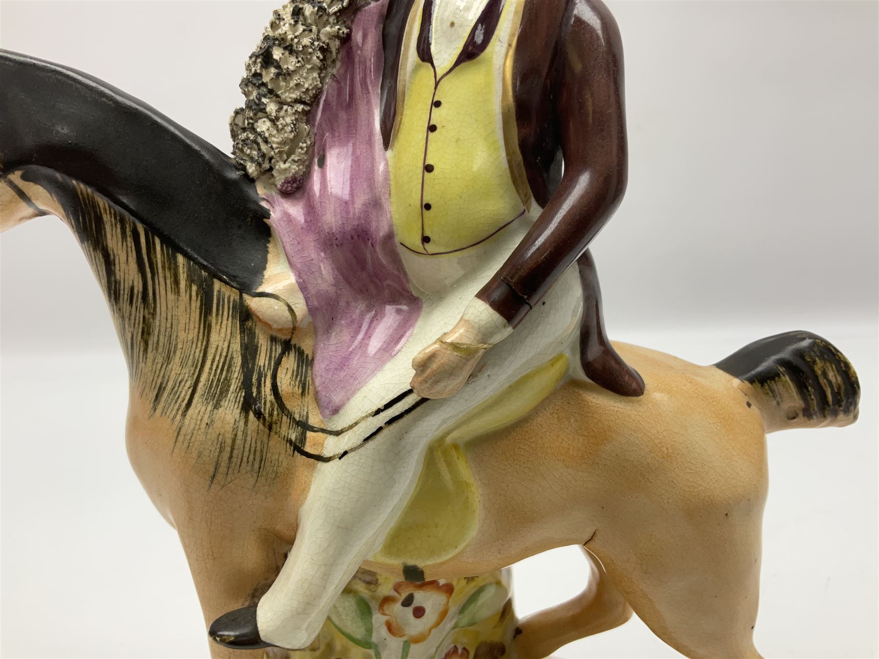 19th century Staffordshire figure of Robert Peel, titled 'Sir Robert Peel', modelled on horseback, atop an oval plinth base featuring a naturalistic and floral design, H30cm 