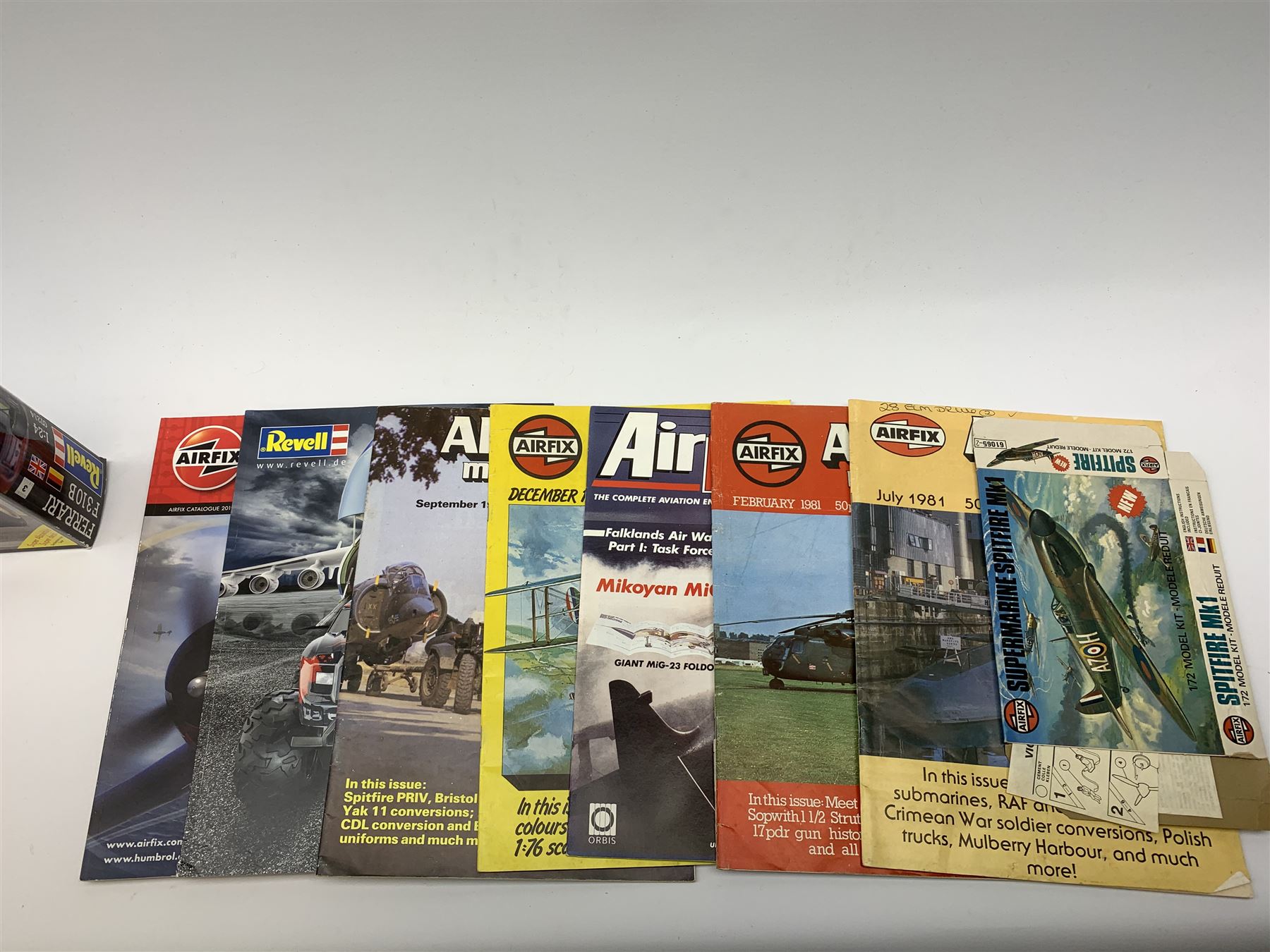 Seven plastic model construction kits - Airfix Vodaphone McLaren Mercedes racing car and Jaguar 'E' Type, Revell Ferrari F310B racing car and four tanks by Airfix, Revell and Tamiya; all boxed in factory sealed transparent packaging; together with an Airfix Spitfire kit tin, various model instruction sheets, catalogues and magazines.