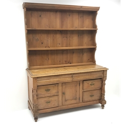  Victorian pine dresser, raised two tier plate rack above two frieze and four drawers, single cupboard, turned supports, W146cm, H197cm, D58cm  