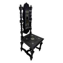 19th century Italian ebonised side chair, the backrest inlaid with bone and decorated with a painted figure in Renaissance dress within an arched reserve, flanked by turned supports and scrolled cresting, the seat and frieze similarly inlaid, raised on turned legs with shaped stretchers