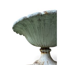 Coalbrookdale - pair of 19th century cast iron petal rim urns, squat form on square plinth, finished in distressed white paint, design registration number 133334, first registered 19 september 1860, number 19 in the Coalbrookdale Castings Catalogue (see illustration)