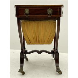 Sheraton period mahogany work table, the shaped banded and strung top with central fan inlay, single drawer with sliding bag beneath, serpentine upright supports on platforms with splayed feet terminating at brass hairy paw castors