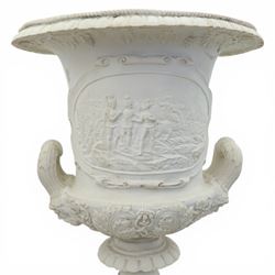 Pair of composite campana urns on stands, the urns decorated with relief figural panels and foliate bands with scrolling handles, on circular socles, the pedestals of square tapering form with moulded edges and applied classical motifs