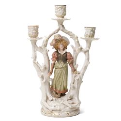 Alfred Stellmacher - Pair of three branch candelabra of naturalistic form, each with a central standing figure on circular bases with gilt highlights H37cm