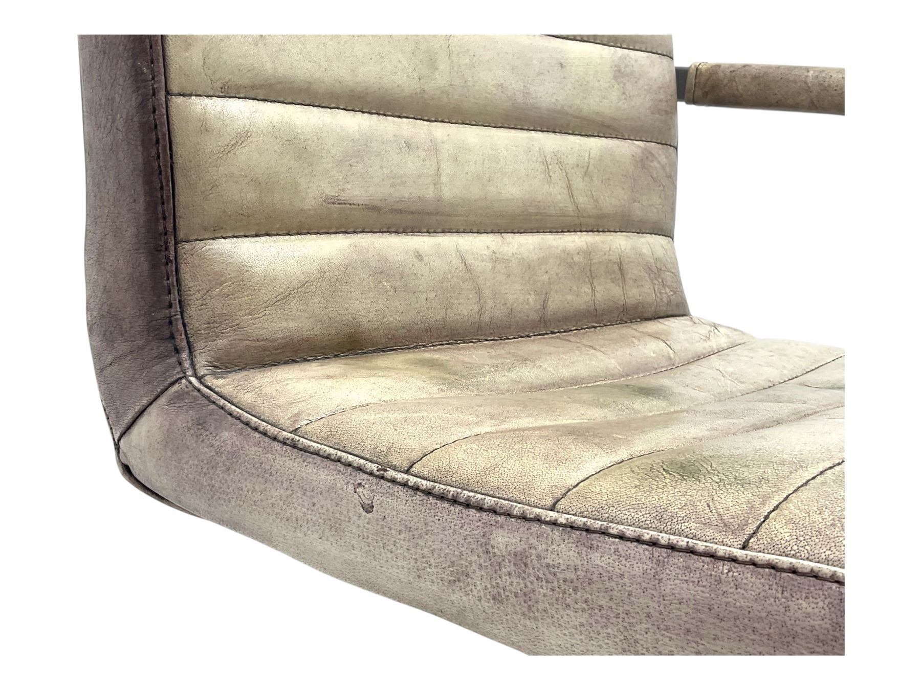 Pair of contemporary industrial style armchairs, each featuring a squared steel cantilever frame with upholstered arms, the seat and back finished in channel-stitched distressed tan faux leather