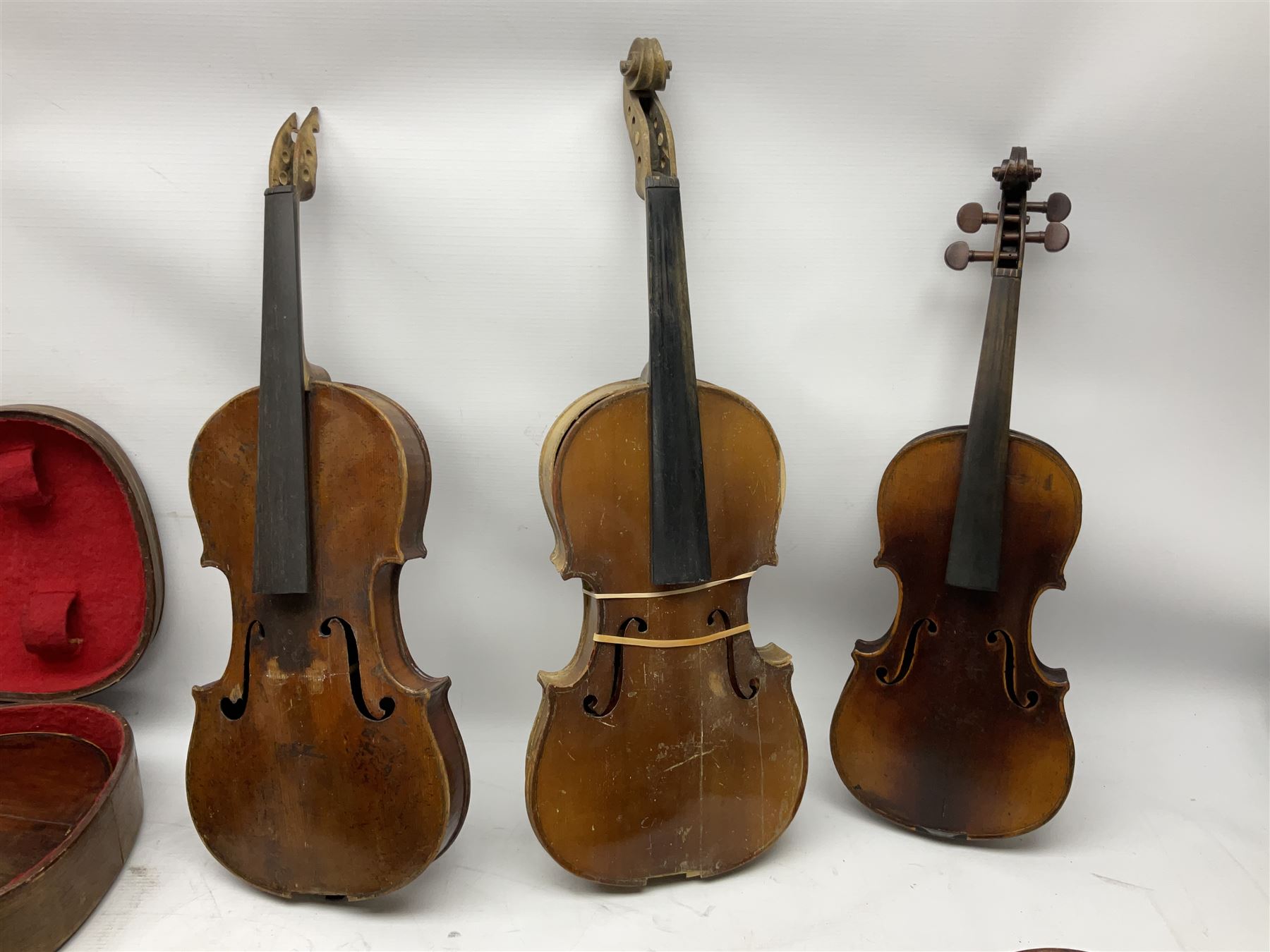 French violin for restoration with 36cm two-piece maple back and ribs and spruce top, bears label 'Lutherie Artistique M. Couturieux'; in wooden case; two modern three-quarter size violins in cases; and five violins for spares or repair