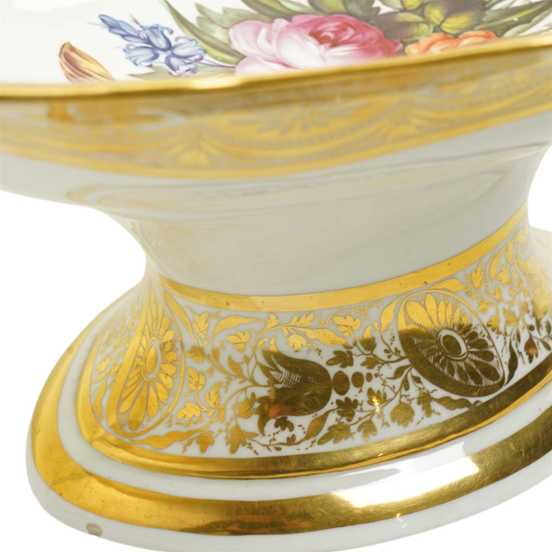 Early 19th century Derby comport of shaped oval design, the interior painted with a large spray of Spring flowers, the gilt border with a continuous band of flower heads repeated on the oval foot, red painted mark, pattern 42 L34cm