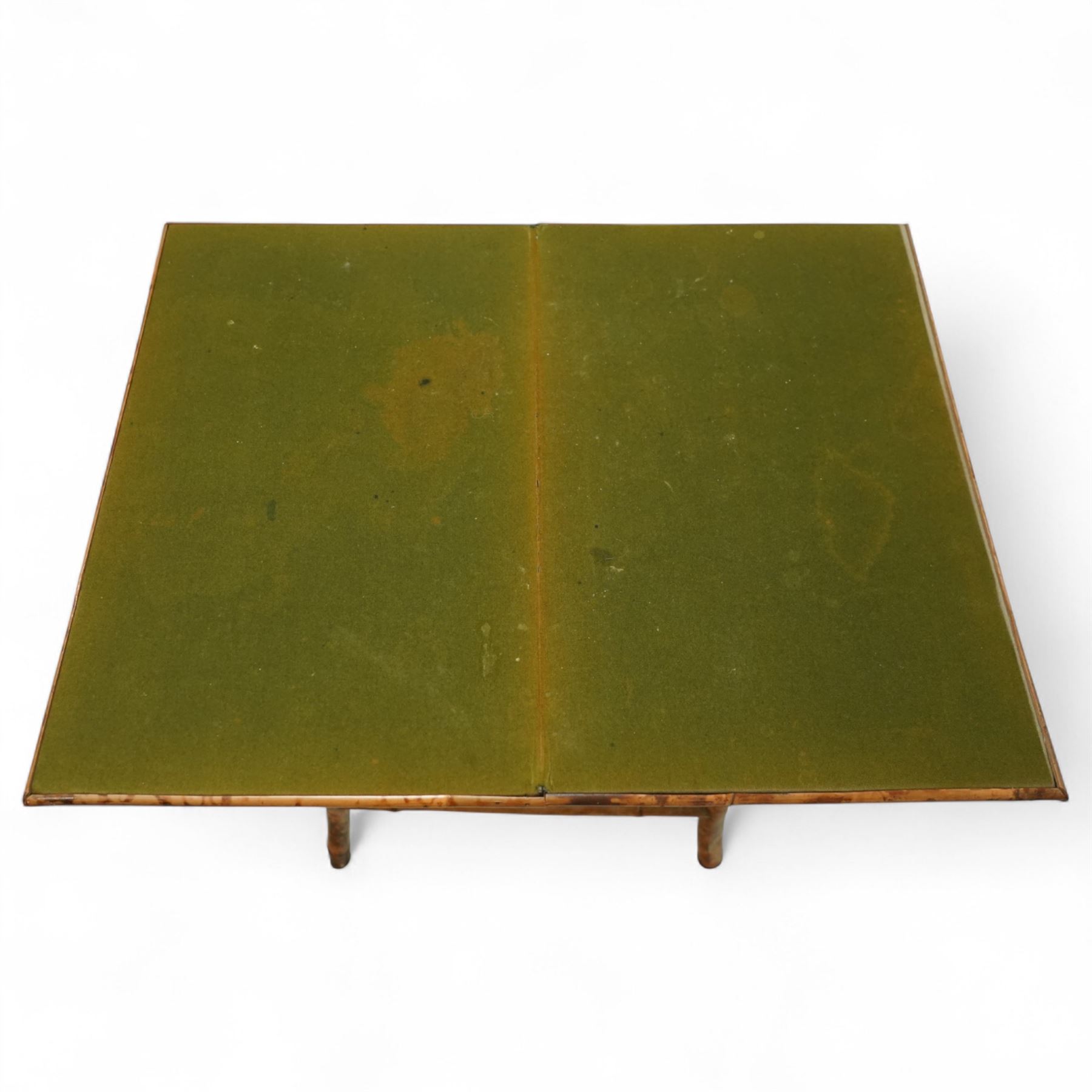 Late Victorian bamboo and lacquered card table, the top decorated with birds and floral sprays, hinged to reveal a baize playing surface, on bamboo effect legs with lacquered undertier