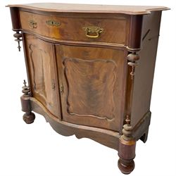 Victorian mahogany serpentine side cabinet, fitted with single drawer over panelled cupboard enclosing single shelf, raised on turned bun feet