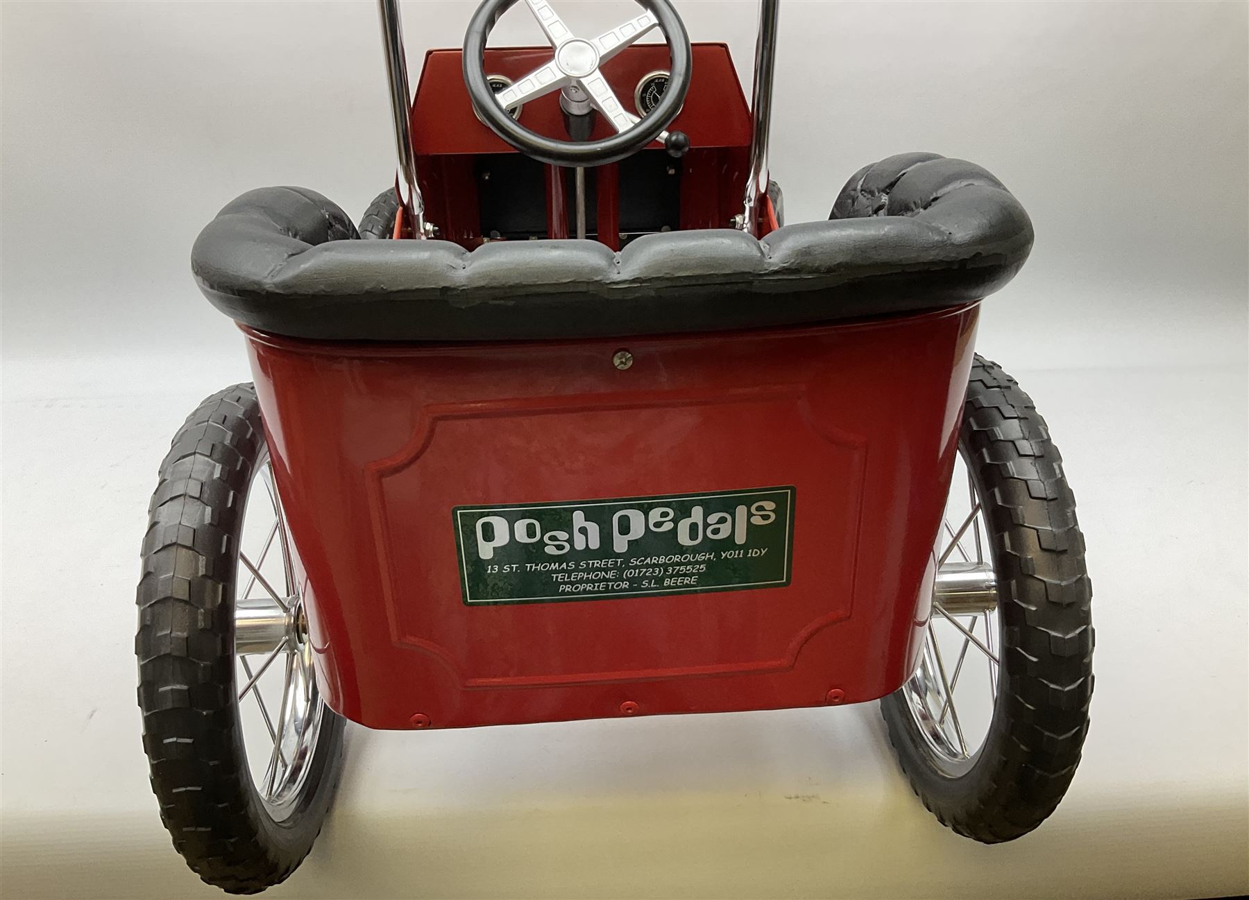 Red child's tin-plate pedal car with chrome detail, by Posh Paddles, Scarborough, H56cm, L80cm