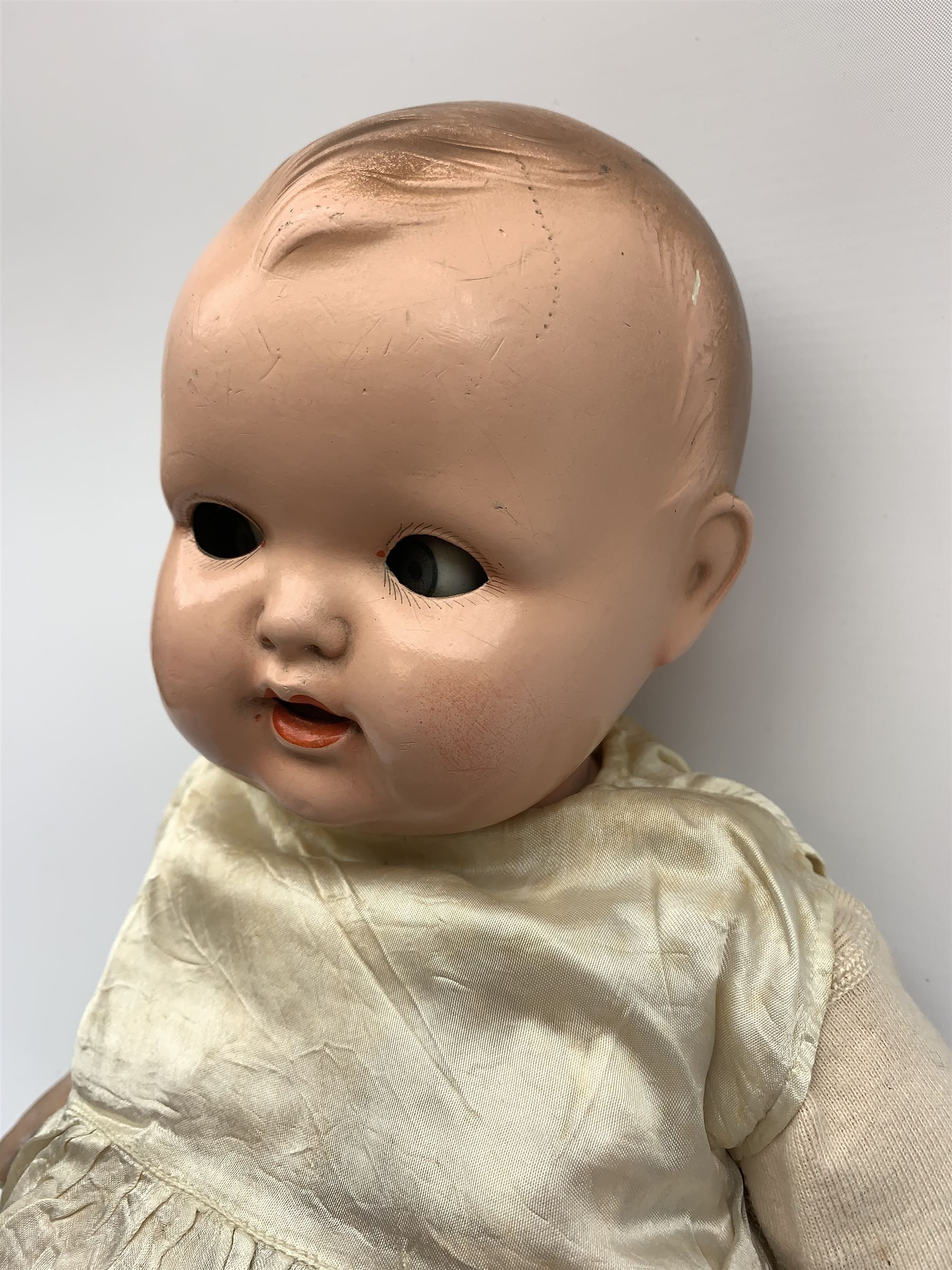 Seyfarth & Reinhardt composition head baby doll with moulded hair, sleeping flirty eyes, open mouth with one tooth and tongue and soft body with composition jointed limbs, marked 'SuR Germany 30/5' H47cm; together with a Golborne Dolls 'Golborne Beauty' composition head and body bride doll, marked 'F.P.23' in original box H63cm (2)