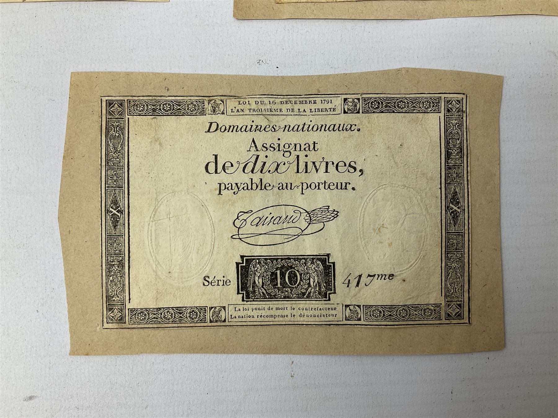 Five French Revolutionary period assignat notes (notes of this type were issued between 1789 and 1796), each mounted on paper