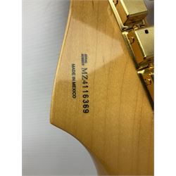 Fender Stratocaster 50th Anniversary 2004 metallic gold electric guitar; serial no.MZ4116369; L98cm; in Spider fitted case with owners manual and other paperwork, strap and belt buckle etc