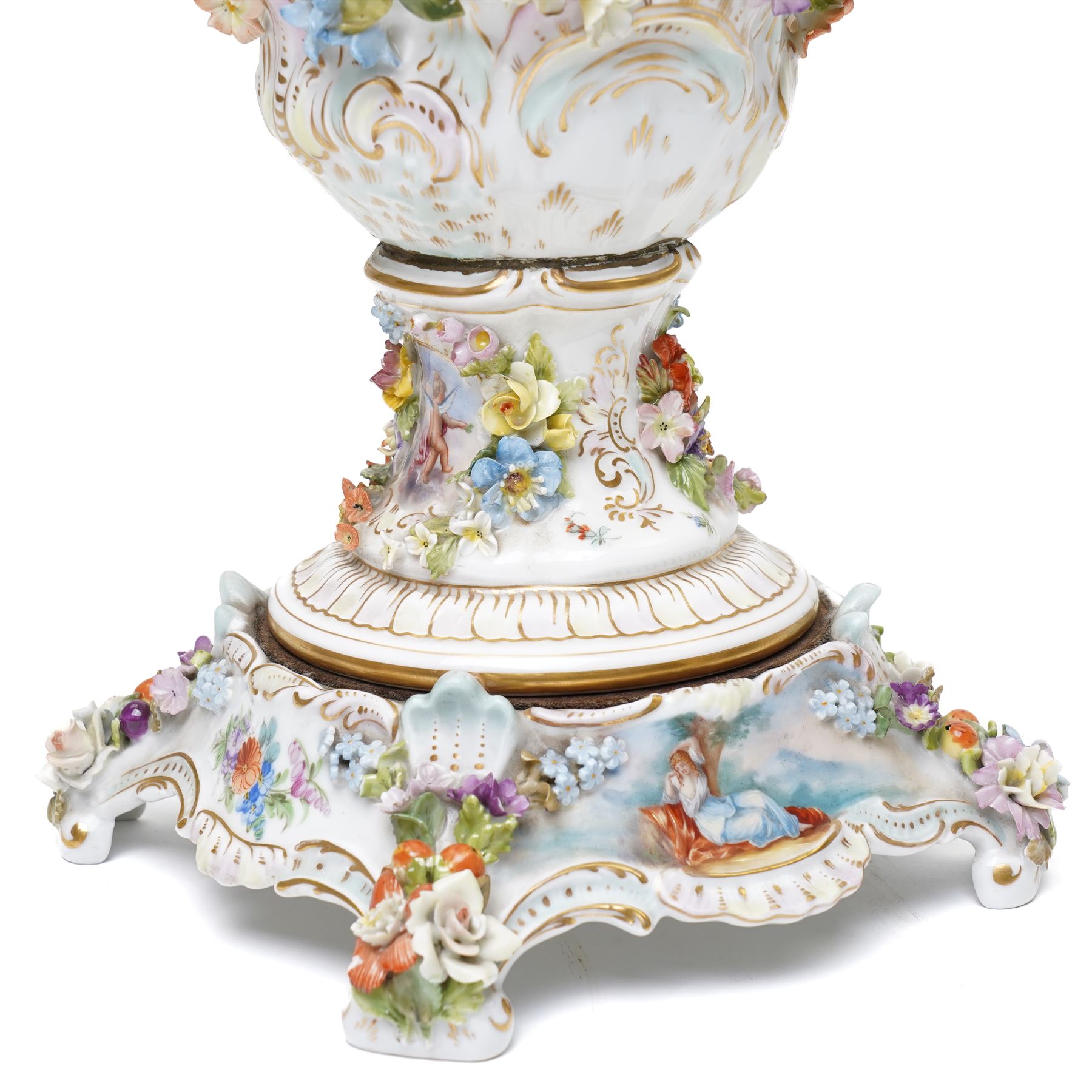 Pair of 19th century Potschappel porcelain two handled vases with covers and stands, painted with scenes of classical figures including Dionysus and Ariadne and with profusely applied flower heads on a scrolling field with gilt highlights H49cm (2)