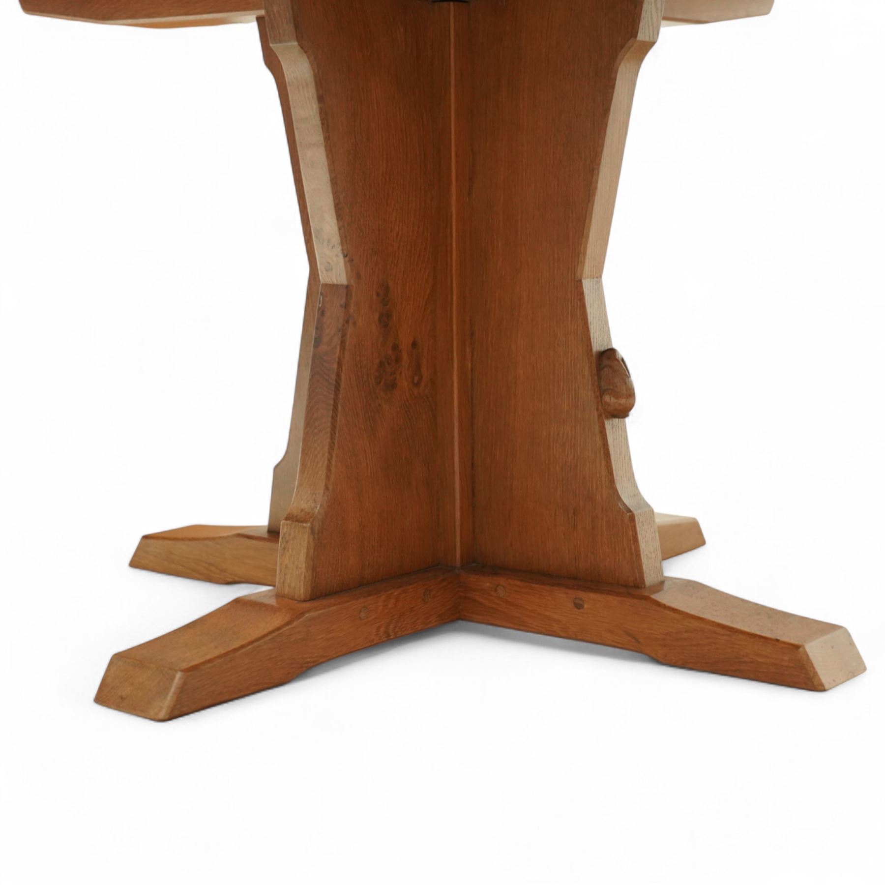 Rabbitman - circular oak dining table, adzed oak octagonal concave dining table, raised on a cruciform base, the supports and sledge feet also adzed, carved with rabbit signature, by Peter Heap of Wetwang