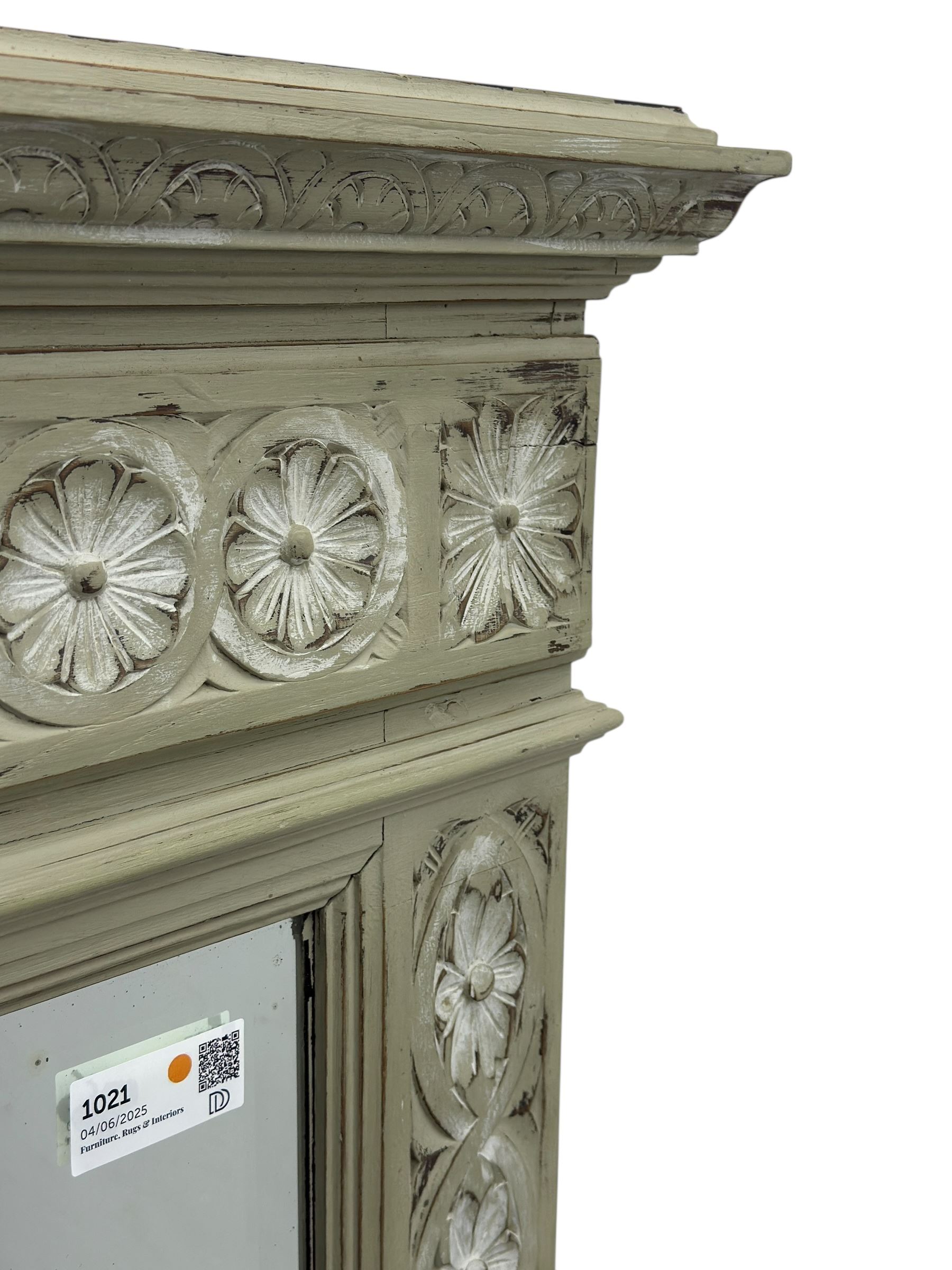 Victorian green and white painted mirror, rectangular bevelled plate within a moulded frame carved in relief with a continuous band of flowerhead roundels, the upper section with stepped cornice and leaf carved frieze  