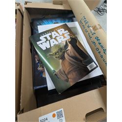 Star Wars collectables, including Mandalorian helmet, Topps foil caps, plastic cups, mug, figures, Masterworks Movie collection, Return of the Jedi Poster, magnets, watch, etc,in three boxes