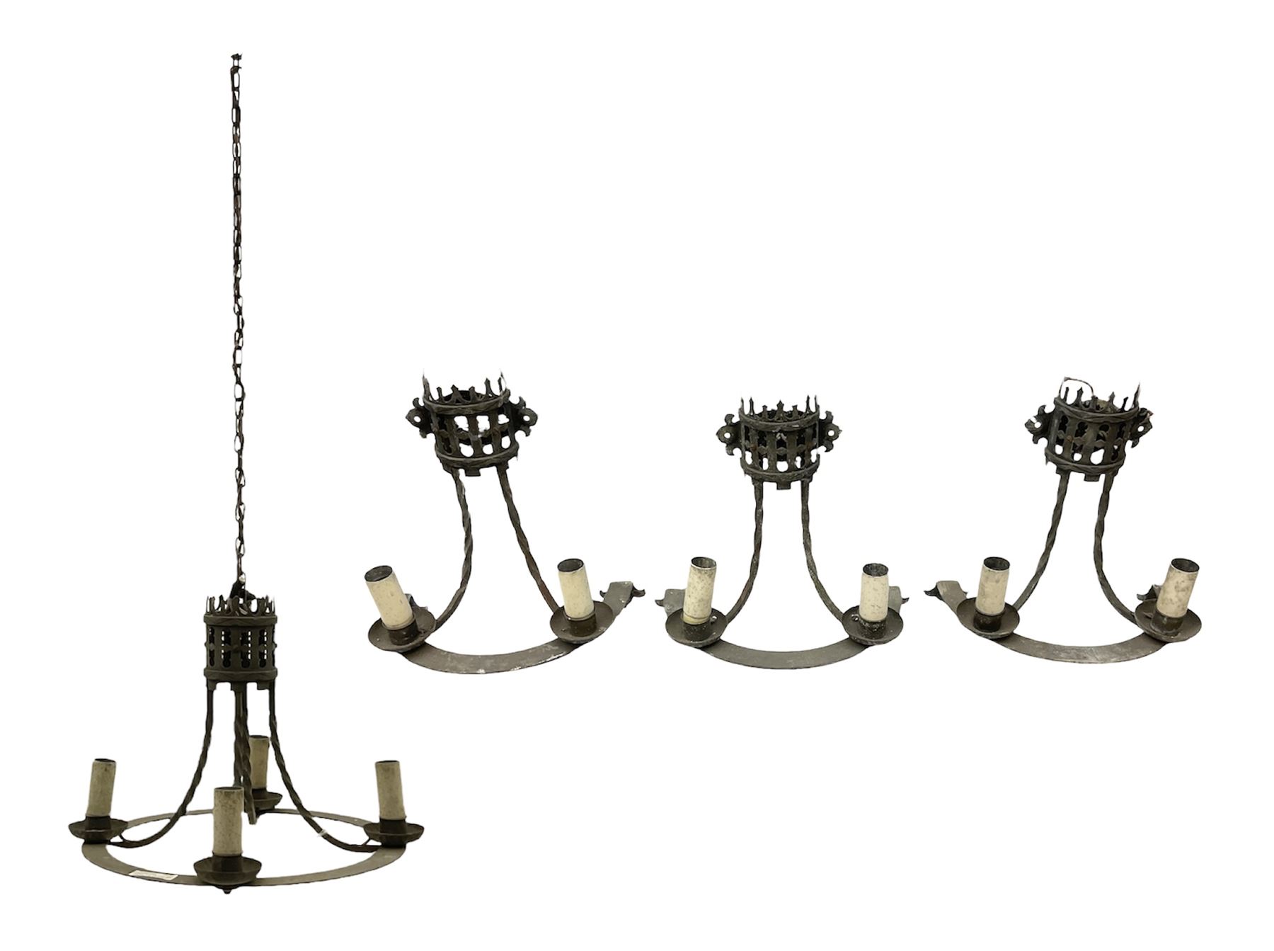 Gothic style iron chandelier with drip pans and twisted branches together with three matching twin wall sconces