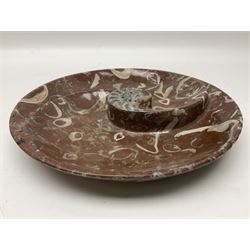 Large circular dish with a raised Goniatite to the centre and Orthoceras inclusion, age: Devonian period, location: Morocco, D30cm
