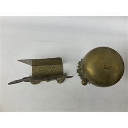 Collection of victorian and later brass desk accessories, to include a letter holder with cherub design, ink well of square form with hinged lid, brass table bell, brass casket with relief decoration, etc  