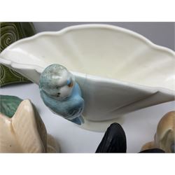Collection of Sylvac and similar animal figures, including rabbits, hares and dogs, together with Falcon budgie vase, etc 