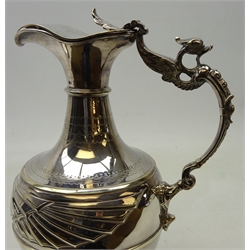  Silver-plated claret jug, the body decorated with two mythical winged creatures, below a bright-cut chased neck and phoenix moulded handle, H27cm and a late Victorian silver-plated toast rack of boat form by Jonathan Bell & Sons, Sheffield (2)   