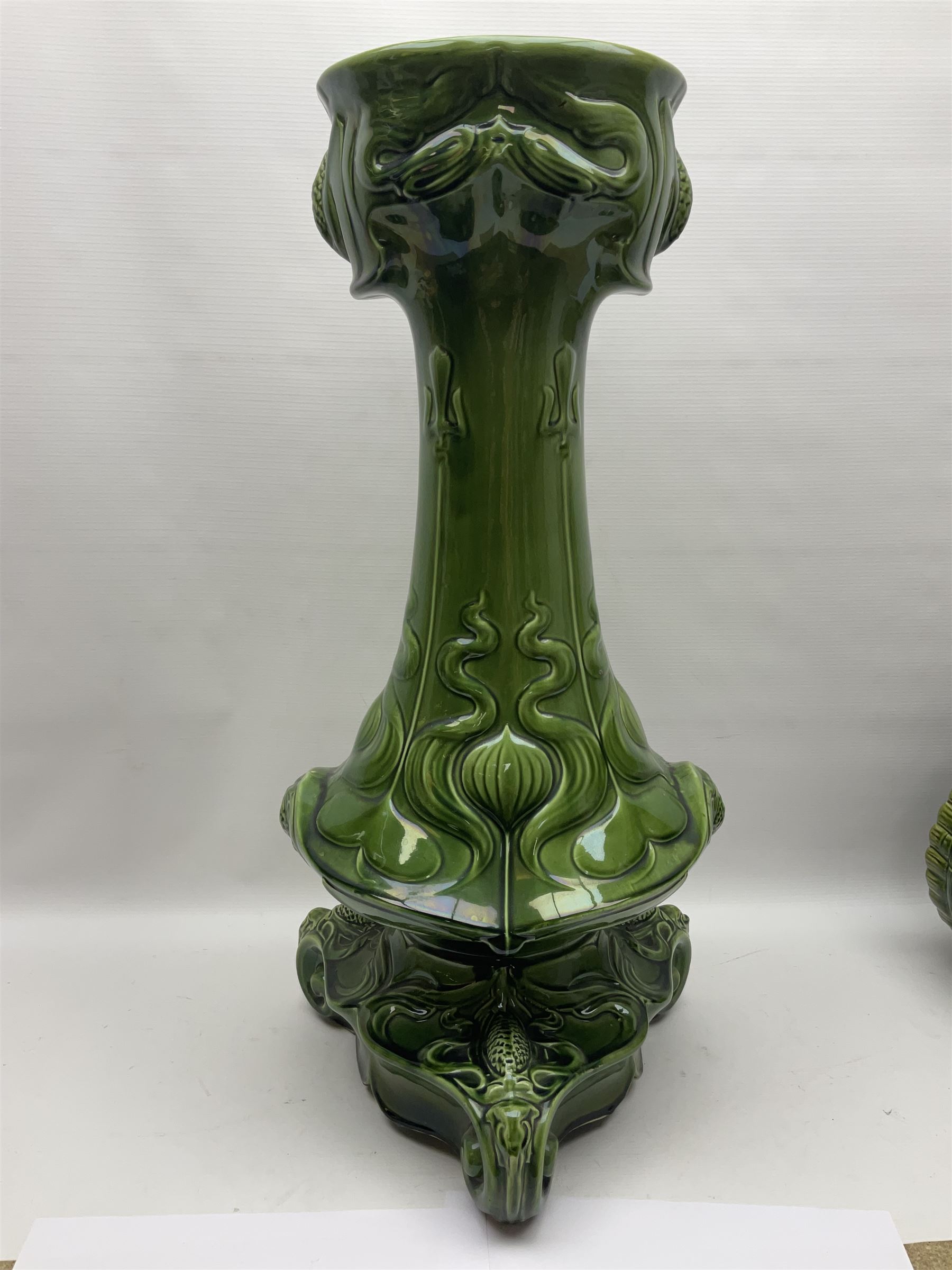 Jardiniere and stand, the jardiniere modelled as a pale, the stand with foliate and foliage decoration on a green ground, stand H73cm 