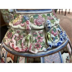 Large pair of 19th century Cantonese famille rose vases, each painted with various courtly scenes, including a display of warriors fighting on horseback before an official and his attendants, double Buddhist lion handles and applied at the shoulders with chilong, the lower band painted with Greek key motif, H58cm (2)