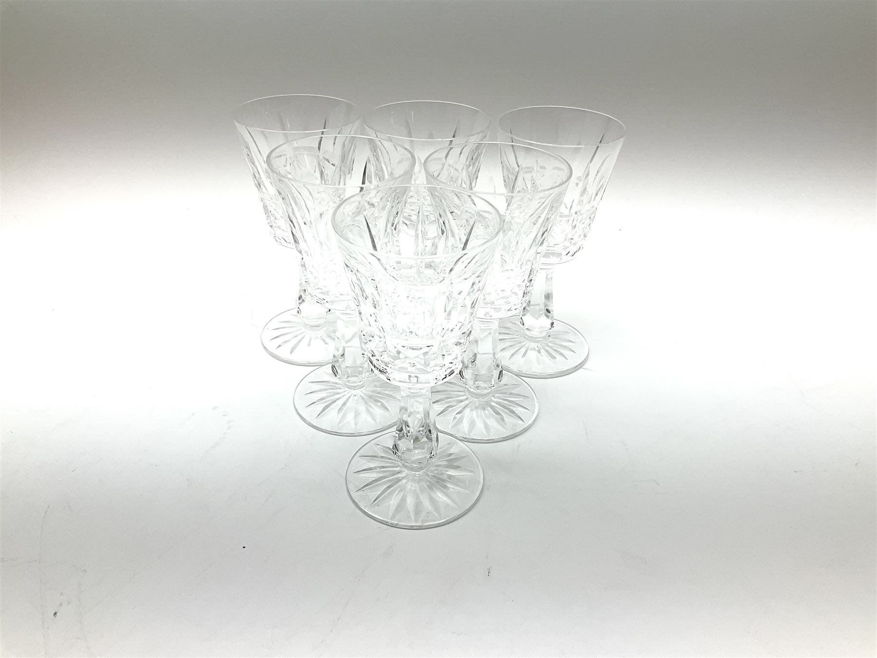 Set of six Waterford Crystal sherry glasses, together with three Stuarts Crystal Glengarry pattern flutes, a Stuart Crystal ships decanter, and an Edinburgh Crystal square section decanter. 