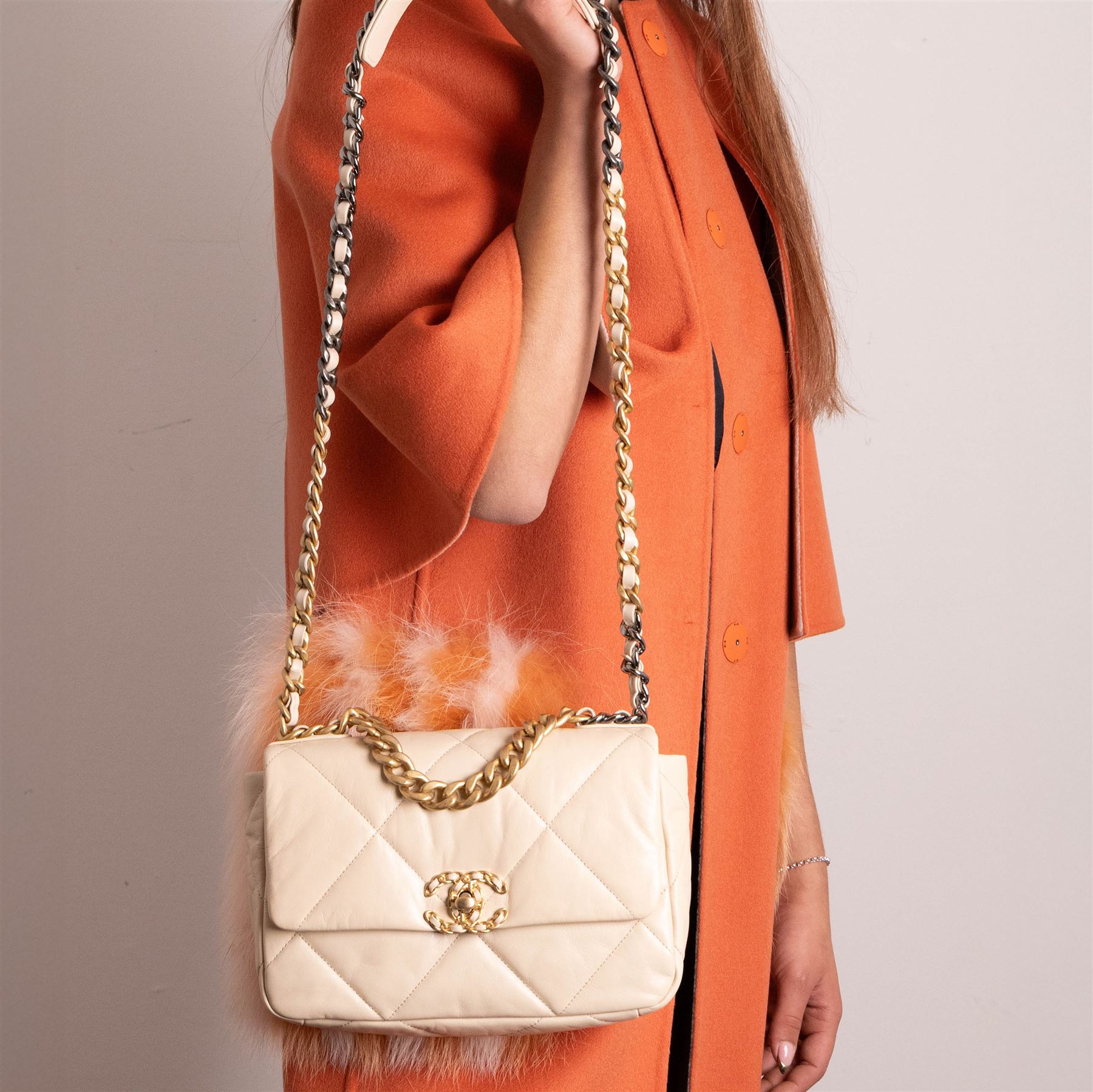 Chanel - ‘19’ Medium Flap Bag, the model introduced in 2019 as one of the final designs associated with Karl Lagerfeld, in cream quilted lambskin leather with mixed gold, silver and ruthenium-tone chain strap and signature CC monogram turn-lock fastening, unused with original dust bag and box