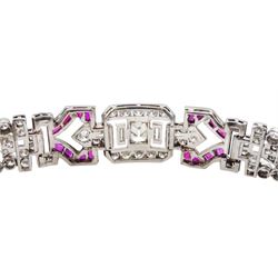 Art Deco platinum diamond and ruby bracelet, circa 1920-1930, the central panel set with a single emerald cut diamond of approx 0.55 carat, flanked by two baguette cut diamonds and old cut diamond surround, the articulated geometric design bracelet with vari-cut rubies, round and baguette cut diamonds, total diamond weight approx 7.00 carat, in Mappin & Webb silk and velvet lined box