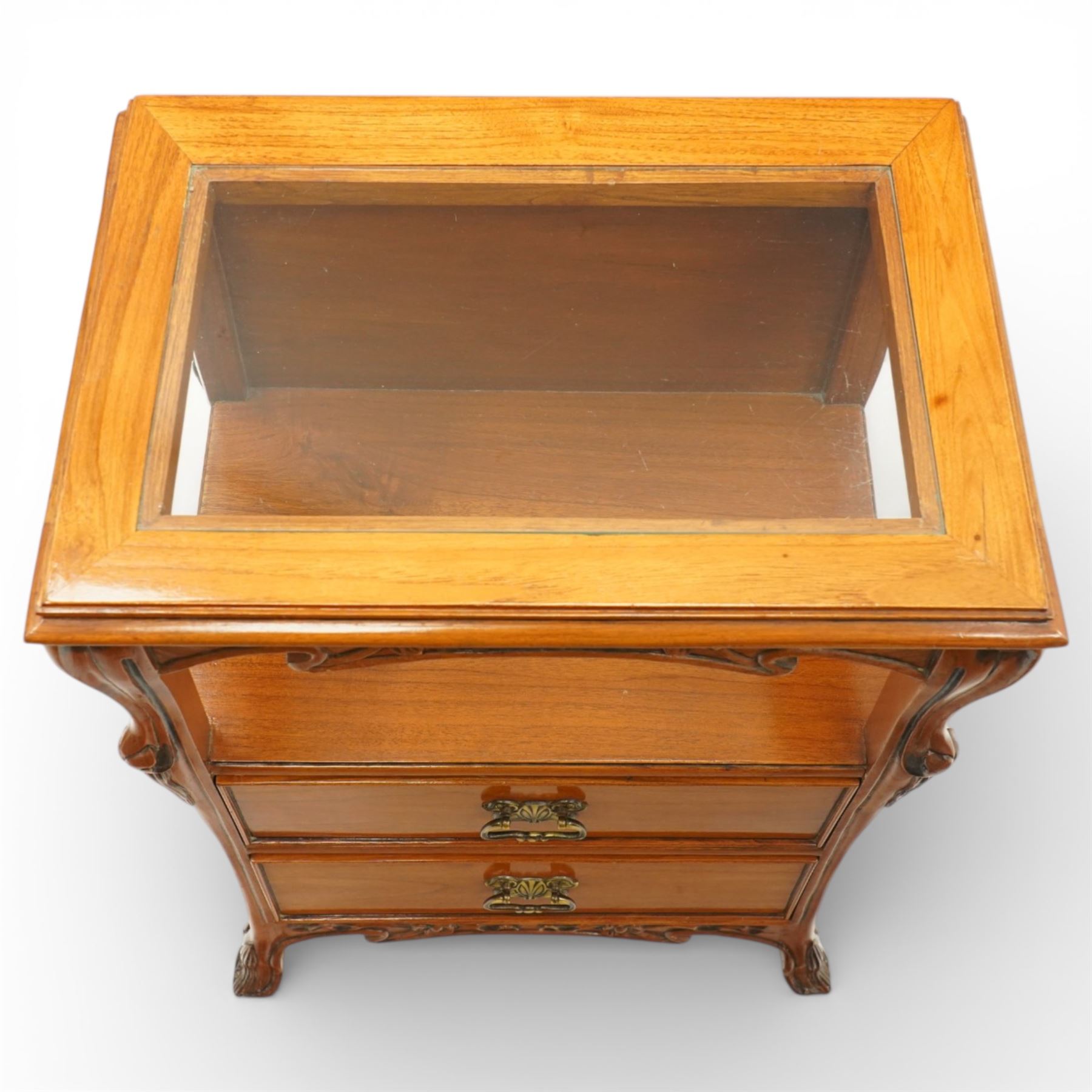 And So To Bed - pair of cherry wood and cane 'Libertine' bedside tables, glass top above a shaped and carved apron, with open recess above two drawers with brass handle, flanked by caned sides, raised on short cabriole supports 