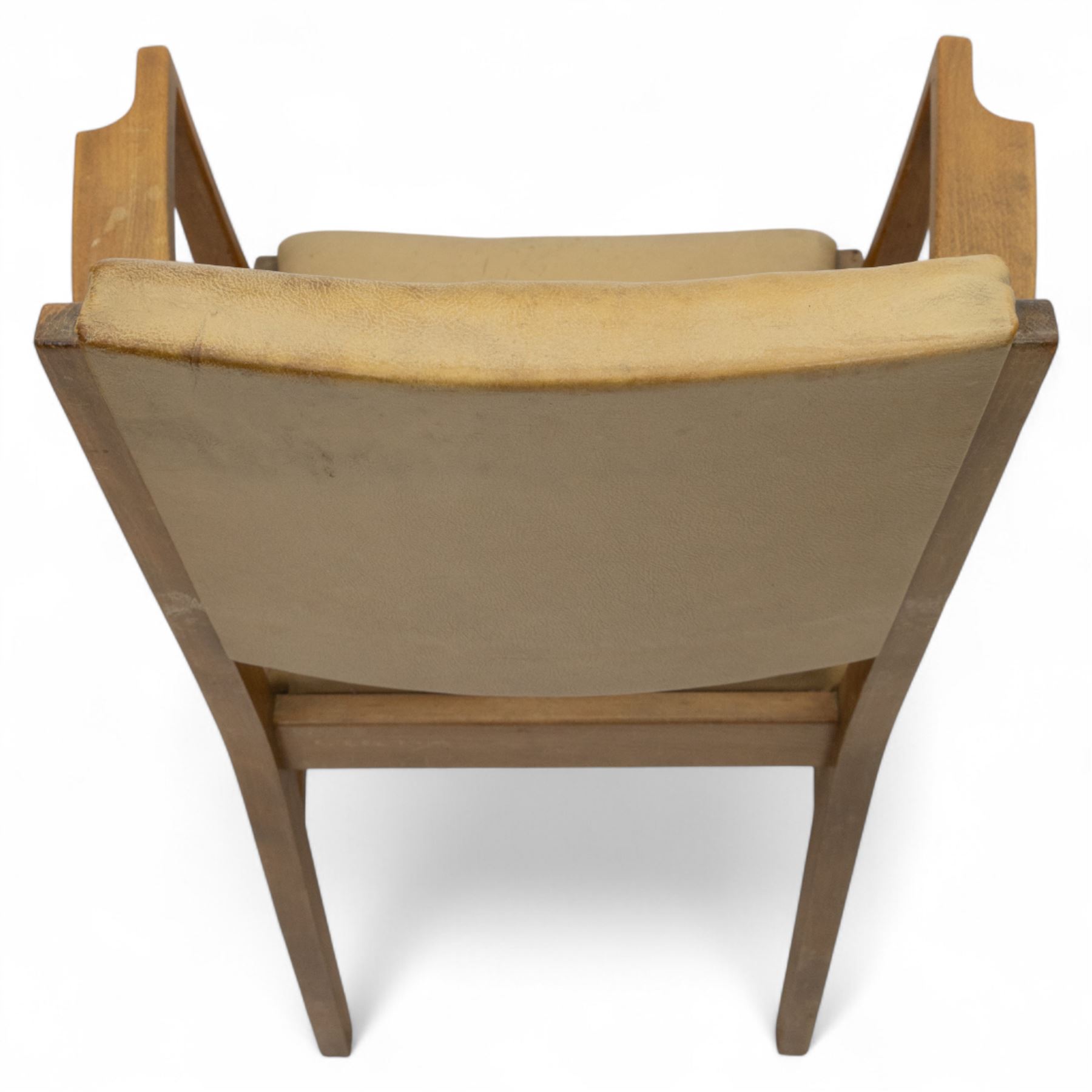 Gordon Russell - mid 20th century teak dining suite, comprising rectangular extending dining table and six matching chairs including one carver, each chair with padded upholstered seat and backrest in vinyl, on square supports, the table with plain top and rounded edges on tapered legs, an example of the firm’s functional post-war design with restrained modernist detailing (Chairs H 85cm, W 47cm, D 46cm) (Extends to 154cm)