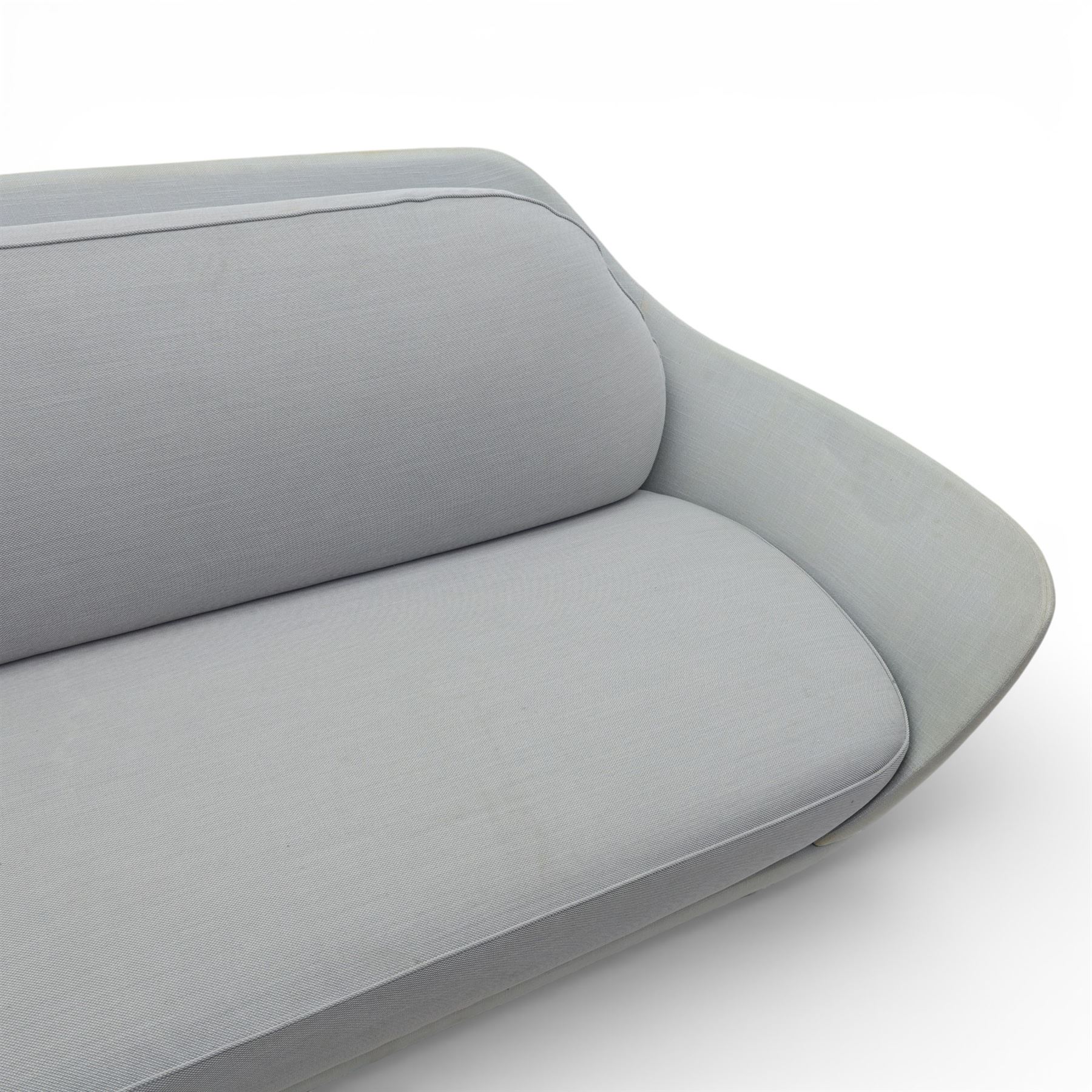 Fritz Hansen - 'Favn' sofa, designed by Jaime Hayon (1974-), upholstered in light grey fabric, the organic curved back and integrated arms enclosing loose seat and back cushions, raised on slender cylindrical metal supports