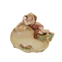 Royal Dux figural bowl, modelled as a young lady lying beside a shell, impressed 562`to base, together with Royal Dux Dutch girl figural baskets, modelled with geese and chickens next to woven baskets, impressed 2278 to base, largest H26cm