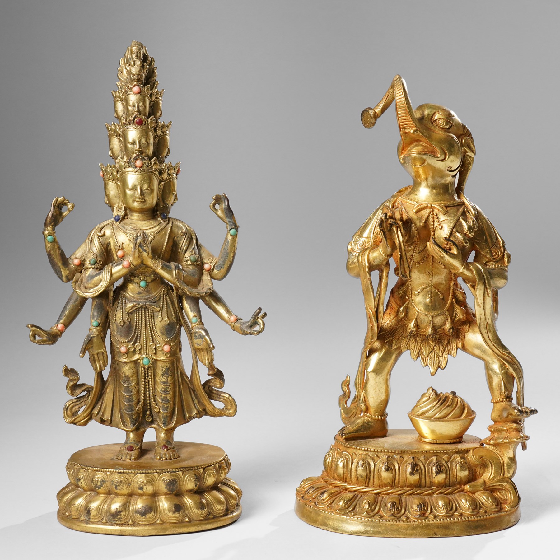 Tibetan gilt bronze figure of Ekadashamukha Avalokiteshvara, standing upright on lotus base, his primary hands in anjali mudra, the other six radiating to the sides, H28cm; together with a gilt bronze figure of Ganesh or Ganapati, H26cm (2)