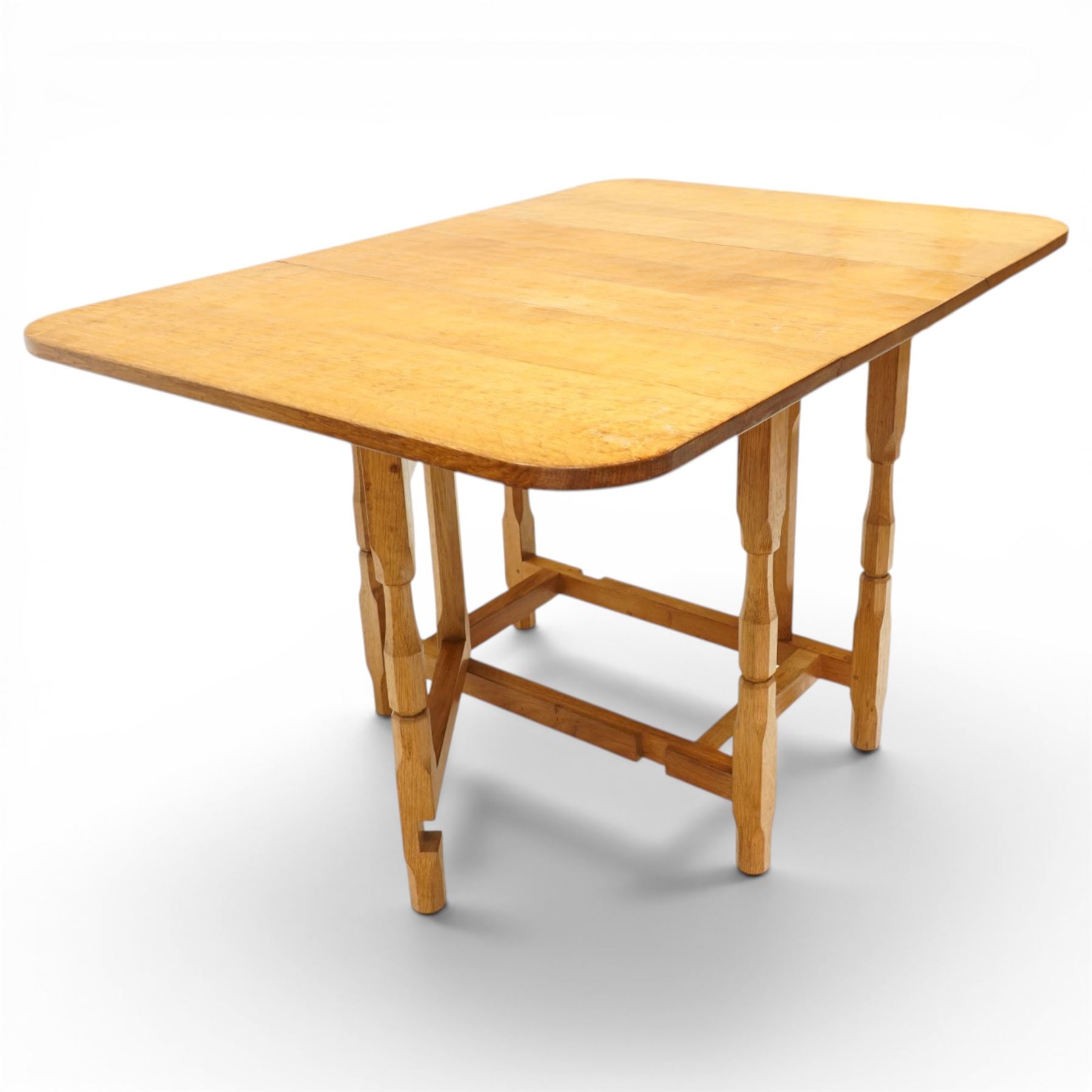 Beaverman - 1980s adzed oak drop-leaf dining table with gate-leg action, adzed top and leaves extending to 129cm, octagonal supports with large Beaver carving, by Colin Almack of Sutton near Thirsk 