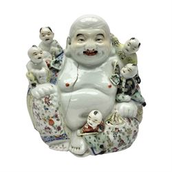 Chinese figure of a happy Buddha, modelled seated with five children, impressed mark to base, H19cm