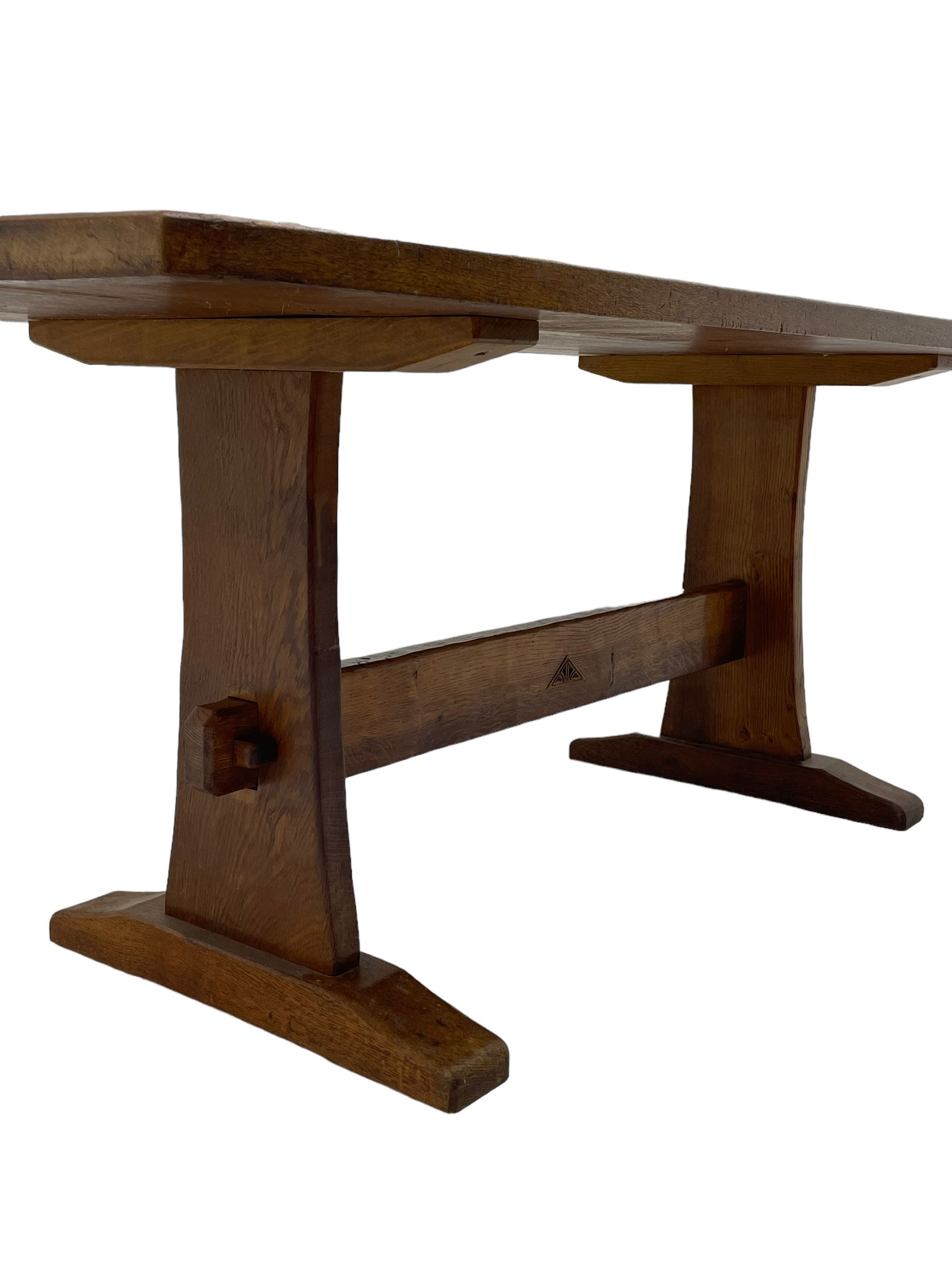 Yorkshire Oak 'Kingpost' - oak dining table, rectangular adzed top on tapered end supports, united by pegged stretchers carved with kingpost signature, on sledge feet, by Robert Ingham, Burton Leonard, Harrogate 