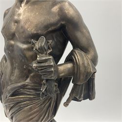 20th century silver plated figure, modelled as a classical male figure, possibly Prometheus, holding flames, one foot resting atop a small dragon, upon a circular spreading base, overall H37.5cm