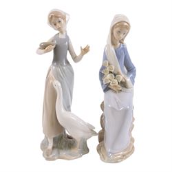 Two Lladro figures, Girl with Calla Lilies and Girl Feeding Goose, together with two other similar figures  