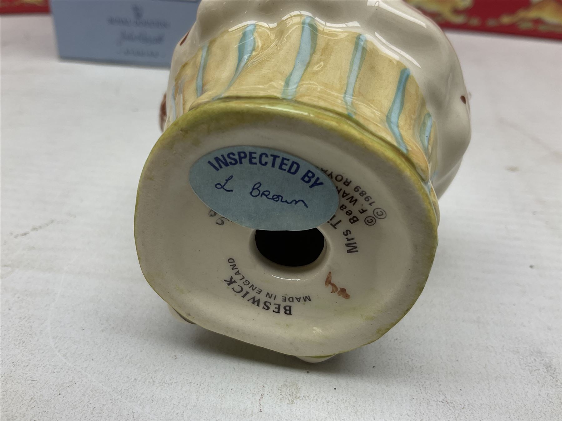 Royal Doulton The Mickey Mouse Collection Pluto figure, Coalport Characters The Snowman Dressing Up figure, three Royal Doulton Bunnykins figures comprising Policeman, Morris Danger and Eskimo, and display stand, Royal Doulton John Beswick Tiggy Winkle, Royal Albert Beatrix Potter Peter Postbag and three Goebel Hummel figures, all boxed